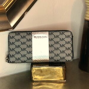 Michael Kors full zip signature wallet.